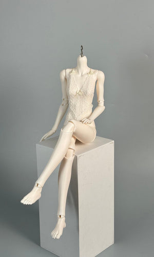 MDollSchool G02 1/4 BJD female doll body wearing a white lace top sitting on a white cube