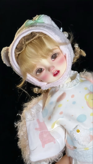 Close-up of Muhan YOSD 1/6 scale BJD doll wearing a white plush bear hat and polka dot outfit
