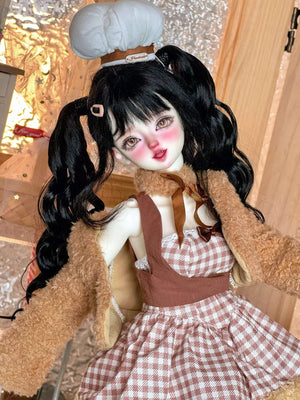 MDollSchool 1/4 MSD BJD doll with black pigtails, brown fuzzy cardigan and checkered dress.