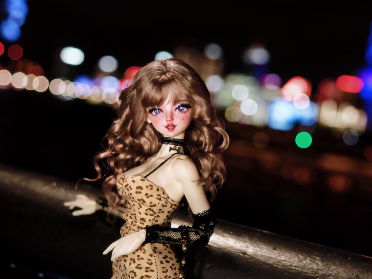 MDollSchool Lucia 1/4 MSD BJD doll in leopard print dress with wavy brown hair at night