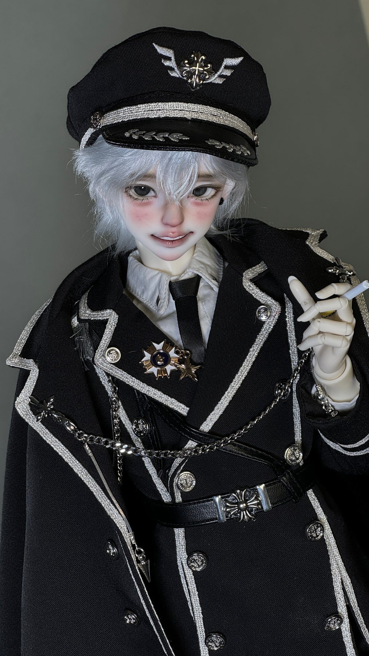 MDollSchool Puppy & Little Wolf BJD doll in a black military outfit with silver trim and cap.