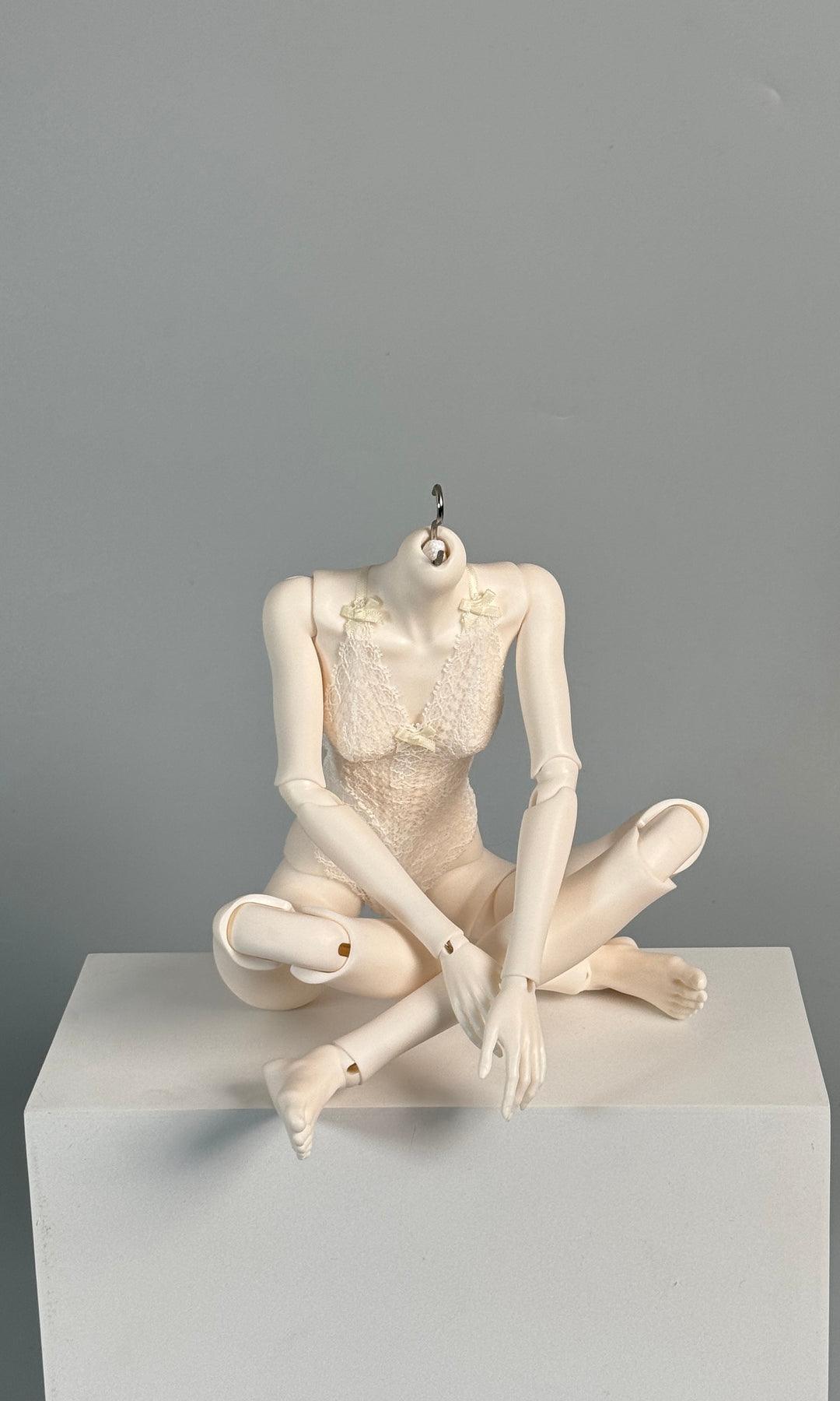 MDollSchool G02 Female MSD 1/4 BJD doll body in a seated pose wearing a white lace bodysuit