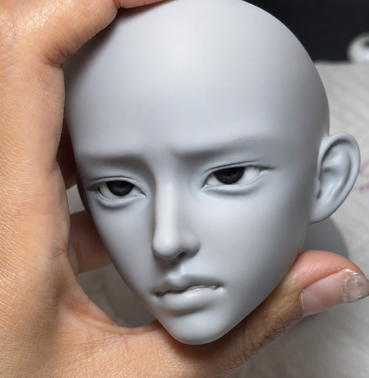 Close-up of Muhan Bao 1/3 scale BJD doll head in grey resin