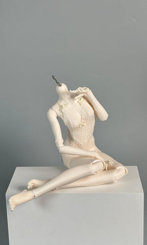 MDollSchool G02 Female Body MSD 1/4 BJD doll in a seated pose on a white platform