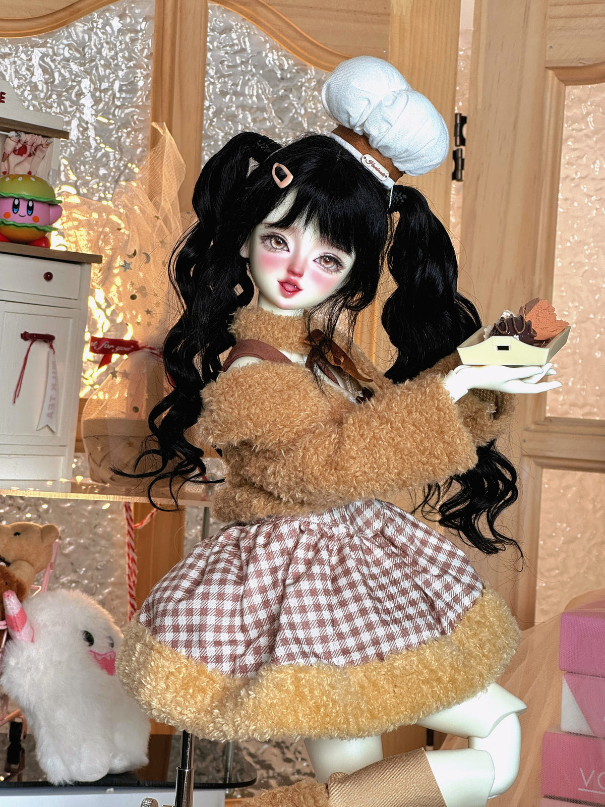 MDollSchool Lucia 1/4 MSD BJD doll in a brown fuzzy outfit and chef hat holding a cake tray
