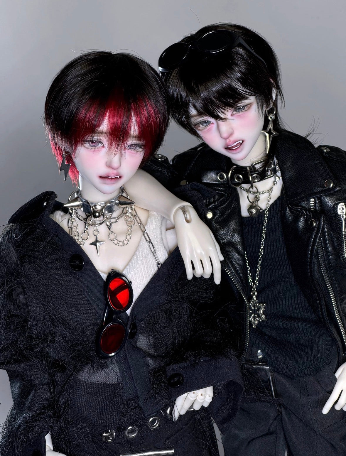 Two MDollSchool Bao BJD 1/4 scale dolls in gothic punk fashion with black leather jackets.