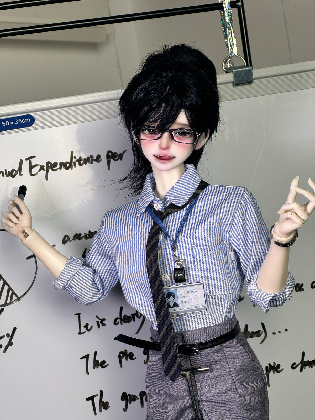 Muhan Abe BJD 1/4 scale doll head in glasses and a blue striped shirt standing by a whiteboard
