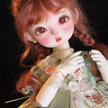 Muhan YOSD BJD doll with red hair, red eyes, and ornate vintage lace dress