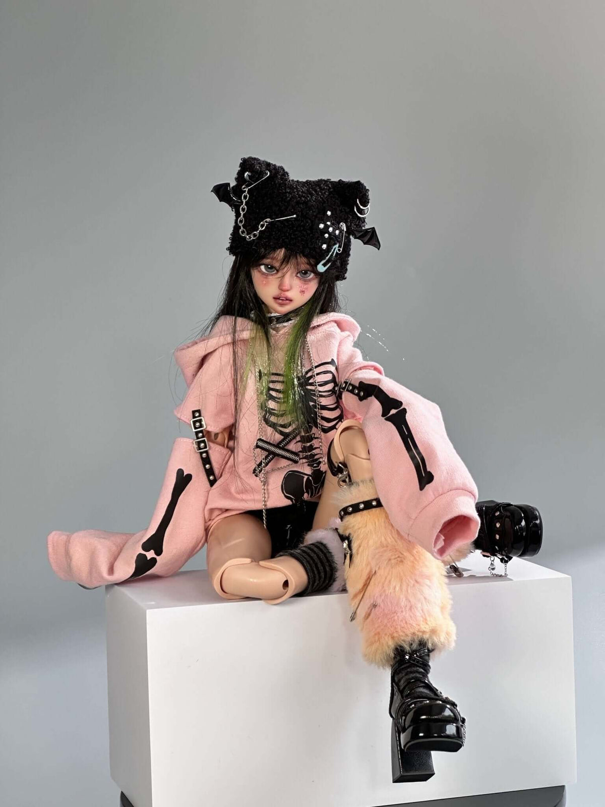 MDollSchool KiKi BJD 1/4 doll in a pink skeleton hoodie and black fuzzy hat