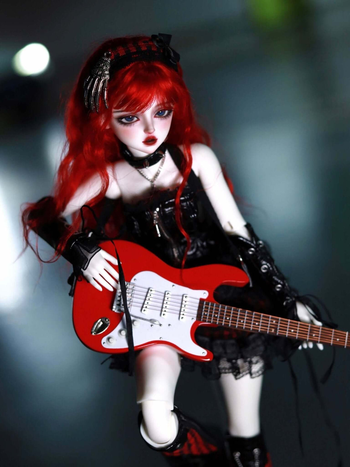 MDollSchool KiKi BJD head doll with red hair in gothic black outfit holding a red electric guitar