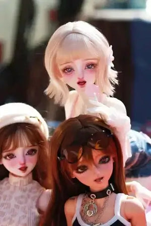 Three customized MDollSchool KiKi & Lucia 1/4 MSD BJD doll heads with detailed faceups.
